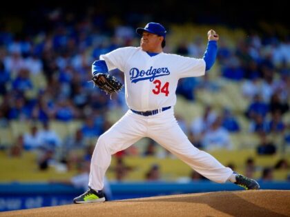 Fernando Valenzuela throws to the plate during the Old-Timers baseball game, Saturday, June 8, 2013, in Los Angeles. (AP Photo/Mark J. Terrill)