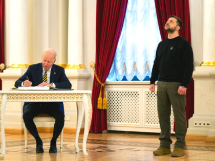 US President Joe Biden signs a guest book during his meeting with Ukrainian President Volodymyr Zelenskyy at Mariinsky Palace during an unannounced visit in Kyiv, Ukraine, Monday, Feb. 20, 2023. (AP Photo/Evan Vucci, Pool)