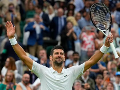 Serbia's Novak Djokovic reacts after beating Italy's Jannik Sinner to win their men's singles semifinal match on day twelve of the Wimbledon tennis championships in London, Friday, July 14, 2023. (AP Photo/Alastair Grant)