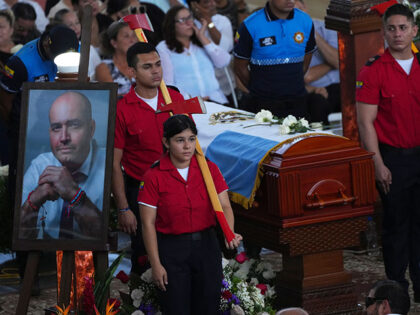 Firemen guard the coffin during the funeral of the Mayor of Manta, Agustin Intriago, who was killed by unknown assailants over the weekend in Manta, Ecuador, Monday, July 24, 2023. Ecuador´s President Guillermo Lasso decreed a state of emergency in Manabi and El Oro provinces, citing the murder of Mayor …