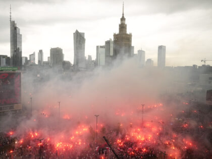 People light flares in Poland's capital as the country marks the 79th anniversary of the start of the Warsaw Uprising, a doomed revolt against the occupying Germans during World War II, in Warsaw, Poland, Tuesday Aug. 1, 2023. In an uneven struggle, poorly armed young city residents rose up on …