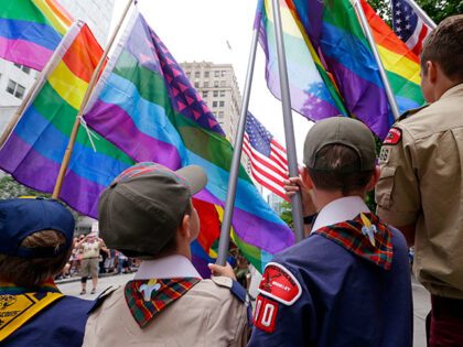 In this Sunday, June 28, 2015 file photo, Cub Scouts and Boy Scouts prepare to lead marchers while waving rainbow-colored flags at the 41st annual Pride Parade in Seattle, two days after the U.S. Supreme Court legalized gay marriage nationwide. On Monday, July 27, 2015, the Texas-based Boy Scouts of …