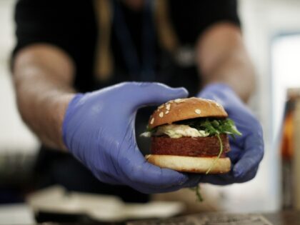 MADRID, SPAIN - DECEMBER 04: A cooker prepares the burguer 'Beyond Meat' which is made of vegetable proteins, during the third day of the United Nations Conference about Climate Change (COP25) in Ifema on December 04, 2019 in Madrid, Spain. (Photo by Eduardo Parra/Europa Press via Getty Images)