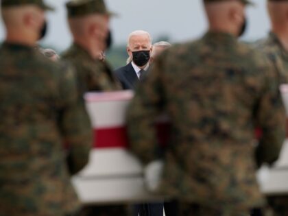 President Joe Biden watches as a carry team moves a transfer case containing the remains of Marine Corps Cpl. Humberto A. Sanchez, 22, of Logansport, Ind., during a casualty return Sunday, Aug. 29, 2021, at Dover Air Force Base, Del. According to the Department of Defense, Sanchez died in an …