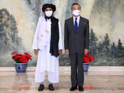 Chinese State Councilor and Foreign Minister Wang Yi meets with Mullah Abdul Ghani Baradar, political chief of Afghanistan's Taliban, in north China's Tianjin, July 28, 2021. (Li Ran/Xinhua via Getty)