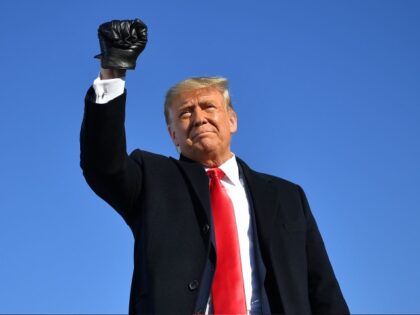 US President Donald Trump pumps his fist as he arrives to a campaign rally at Green Bay Austin Straubel International Airport in Green Bay, Wisconsin on October 30, 2020. (Photo by MANDEL NGAN / AFP) (Photo by MANDEL NGAN/AFP via Getty Images)