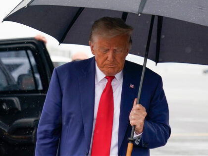 Former President Donald Trump walks over to speak with reporters before he boards his plane at Ronald Reagan Washington National Airport, Thursday, Aug. 3, 2023, in Arlington, Va., after facing a judge on federal conspiracy charges that allege he conspired to subvert the 2020 election. (AP Photo/Alex Brandon)