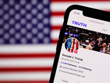 American flag displayed on a screen and Donald Trump account on Truth Social displayed on a phone screen are seen in this illustration photo taken in United States on on June 20, 2023. (Photo by Jakub Porzycki/NurPhoto via Getty Images)