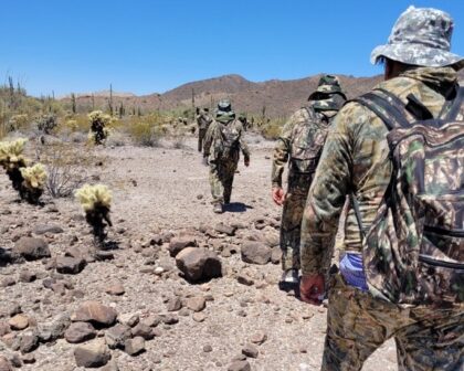 Welton Station Border Patrol agents apprehend a group of camo-wearing migrants in the Sonoran Desert near the border in Arizona. (U.S. Border Patrol/Yuma Sector)