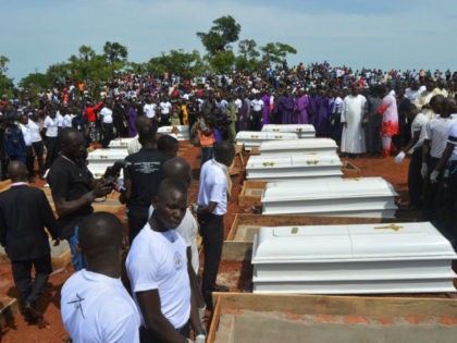 Coffins are prepared for burial during a funeral service for 17 worshippers and two priests, who were allegedly killed by Fulani herdsmen, at Ayati-Ikpayongo in Gwer East district of Benue State, north-central Nigeria on May 22, 2018. - Two Nigerian priests and 17 worshippers have been buried, nearly a month …