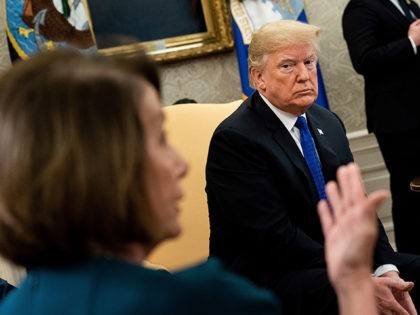 US President Donald Trump (R) listens while presumptive Speaker, House Minority Leader Nancy Pelosi (D-CA) makes a statement to the press before a meeting at the White House December 11, 2018 in Washington, DC. (Photo by Brendan Smialowski / AFP) (Photo credit should read BRENDAN SMIALOWSKI/AFP/Getty Images)
