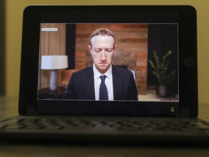 Mark Zuckerberg, chief executive officer of Facebook Inc., speaks virtually during a House Energy and Commerce Subcommittees hearing on a tablet computer in Princeton, Illinois, U.S., on Thursday, March 25, 2021. The chief executives of Facebook, Google, and Twitter are testifying as lawmakers on both sides of the aisle prepare …