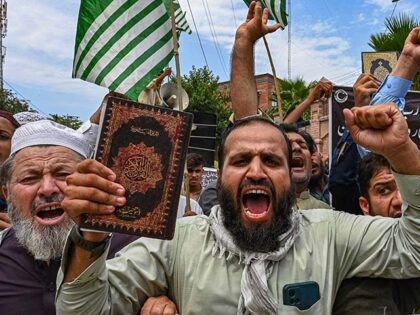 A man holding a copy of the Koran shouts slogans during a demonstration in Peshawar on July 7, 2023, as people protest against the burning of the Koran outside a Stockholm mosque that outraged Muslims around the world. (Photo by Abdul MAJEED / AFP) (Photo by ABDUL MAJEED/AFP via Getty …
