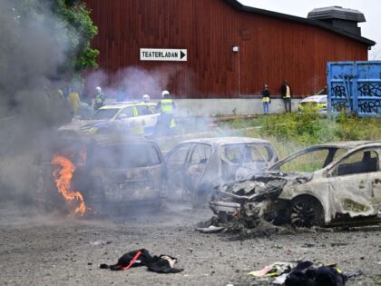 Cars are on fire on the grounds of the Eritrean cultural festival "Eritrea Scandinavia" at Järvafältet in northern Stockholm on August 3, 2023. Swedish police clashed with protesters at the Eritrean pro-regime festival in a Stockholm suburb, police said as media reported that regime opponents threw stones and trashed festival …