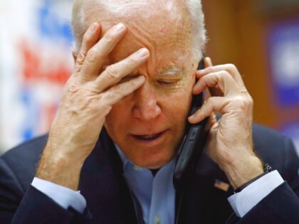 Democratic presidential candidate, former Vice President Joe Biden calls potential caucus-goers during a visit to a campaign field office, Saturday, Jan. 4, 2020, in Waterloo, Iowa. (AP Photo/Patrick Semansky)