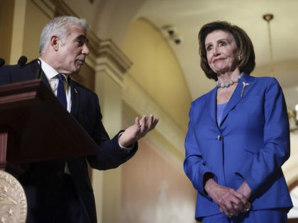 Israeli Foreign Minister Yair Lapid looks to House Speaker Nancy Pelosi (D-CA) as he gives remarks after being welcomed by her at the U.S. Capitol on October 12, 2021 in Washington, DC. (Anna Moneymaker/Getty Images)