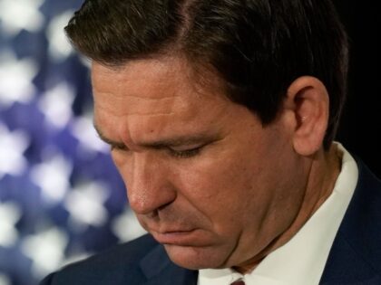 Florida Governor Ron DeSantis listens during a press conference to sign several bills related to public education and teacher pay, in Miami, Tuesday, May 9, 2023. (AP Photo/Rebecca Blackwell)
