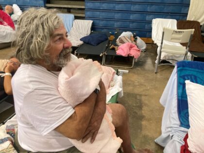 WAILUKU, HI - AUGUST 11: Phil Bailey, 65, a dock worker who escaped the deadly wildfire in Lahaina by jumping into the ocean, recovers at an emergency shelter in Wailuku, Hawaii on Thursday, Aug. 10, 2023. (Photo by Tom Hays for The Washington Post via Getty Images)