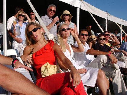 Spectators watch the Mercedes-Benz Polo Challenge July 21, 2001 in Bridgehampton, NY. The Hamptons, located at the east end of New York''s Long Island, is a traditional summer escape for New Yorkers. (Photo by Spencer Platt/Getty Images)