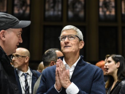 Tim Cook prays for good fortune ( Stephanie Keith /Getty)