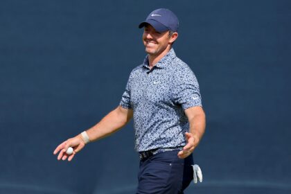 Four-time major winner Rory McIlroy of Northern Ireland reacts after sinking a 40-foot birdie chip on the 17th hole that left him sharing the lead after the first round of the BMW Championship