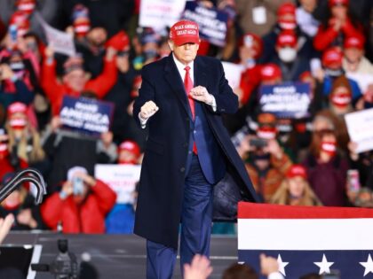 MUSKEGON, MI - OCTOBER 17: US President Donald Trump pumps his fists during a campaign rally on October 17, 2020 in Muskegon, Michigan. After testing positive and reportedly recovering from the coronavirus, President Trump has ramped up his schedule of public events as he continues to campaign against Democratic presidential …