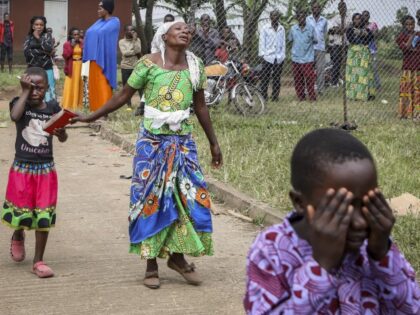 Relatives grieve as they wait to collect the bodies of villagers who were killed by suspected rebels as they retreated from Saturday's attack on the Lhubiriha Secondary School, outside the mortuary of the hospital in Bwera, Uganda Sunday, June 18, 2023. Ugandan authorities have recovered the bodies of 41 people …