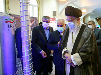 In this photo released by the office of the Iranian supreme leader, Supreme Leader Ayatollah Ali Khamenei, right, visits an exhibition of the country's nuclear achievements, at his office compound in Tehran, Iran, Sunday, June 11, 2023. A U.S. intelligence assessment says Iran is not pursuing nuclear weapons at the …