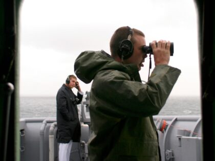 AT SEA - MAY 24: (NEW YORK NEWSPAPERS OUT) BMSN Eric Erks stands at the starboard forward lookout aboard the USS Shreveport (LPD-12), an amphibious assualt ship of sailors and marines, as they makes their way to Fleet Week May 24, 2005 in New York City. During the annual Fleet …