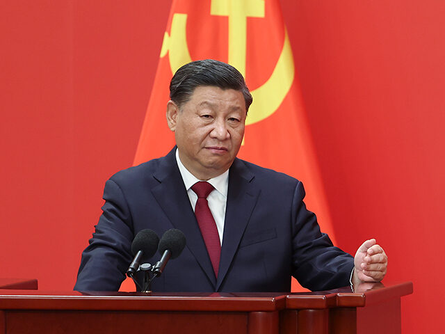 BEIJING, CHINA - OCTOBER 23: Chinese President Xi Jinping speaks at the podium during the meeting between members of the standing committee of the Political Bureau of the 20th CPC Central Committee and Chinese and foreign journalists at The Great Hall of People on October 23, 2022 in Beijing, China. …