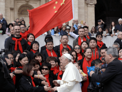 Pope Francis meets a group of faithful from China at the end of his weekly general audience in St. Peter's Square, at the Vatican, Wednesday, April 18, 2018. (AP Photo/Gregorio Borgia)