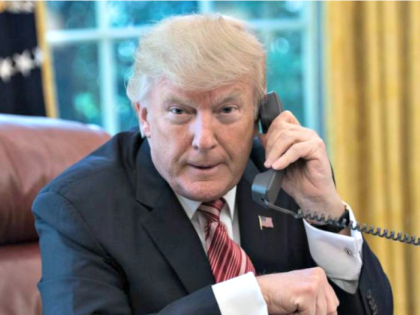 President Donald Trump speaks on the phone at the White House